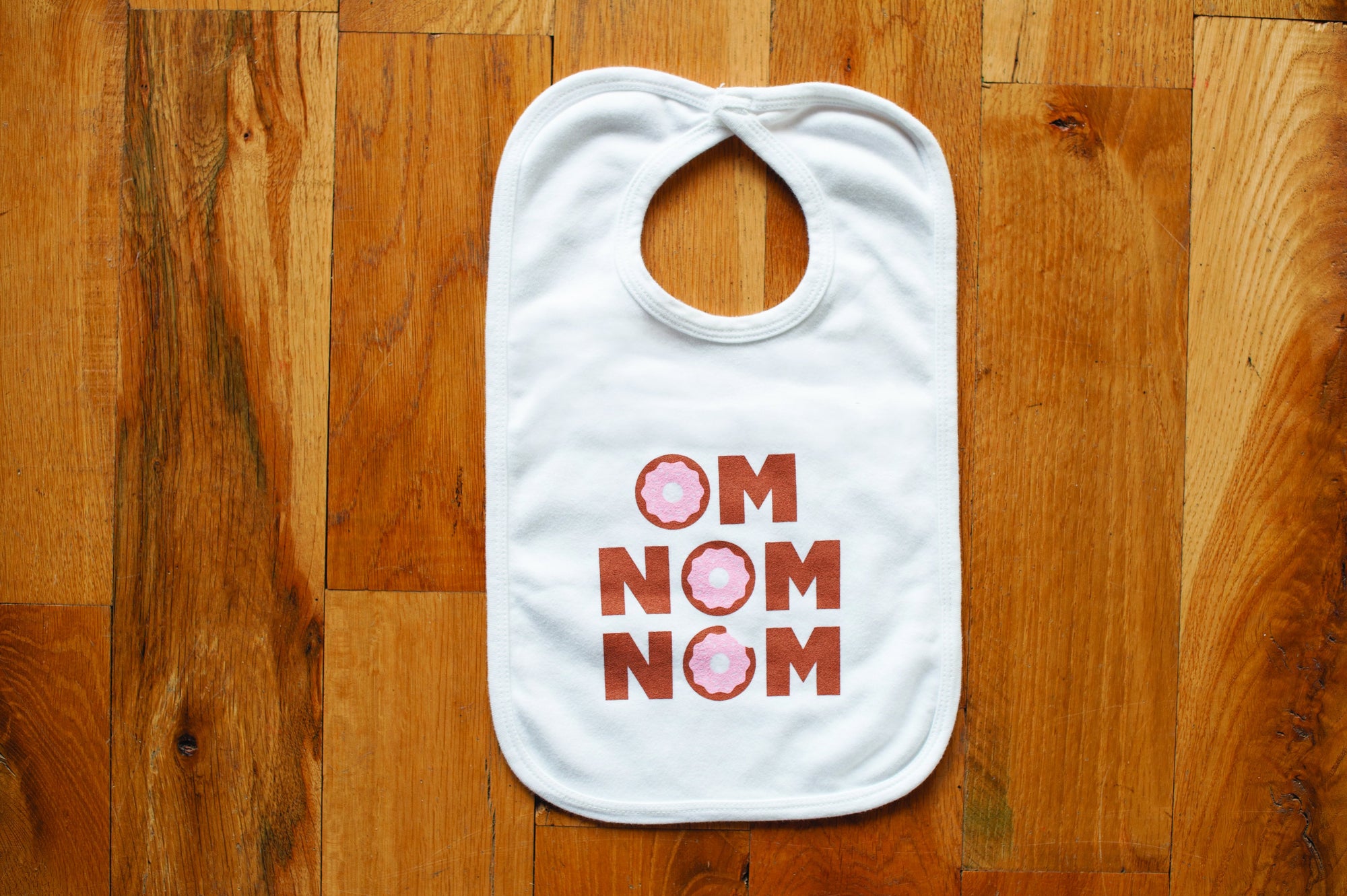 Wood and silicone teethers and baby bibs